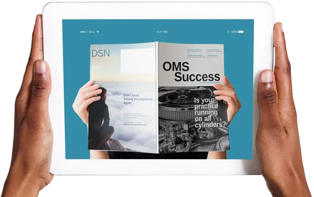 Hands holding a tablet displaying the digital edition of OMS Success magazine
